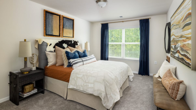 The Cottages at Walker Ridge bedroom with white walls and gray carpeting. Cartersville rental home