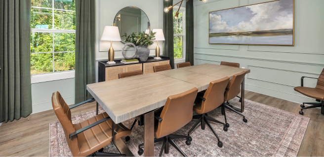 onsite amenities community meeting space with conference table, rolling chairs and two big windows