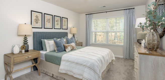 a primary bedroom at The Cottages at Capital Circle